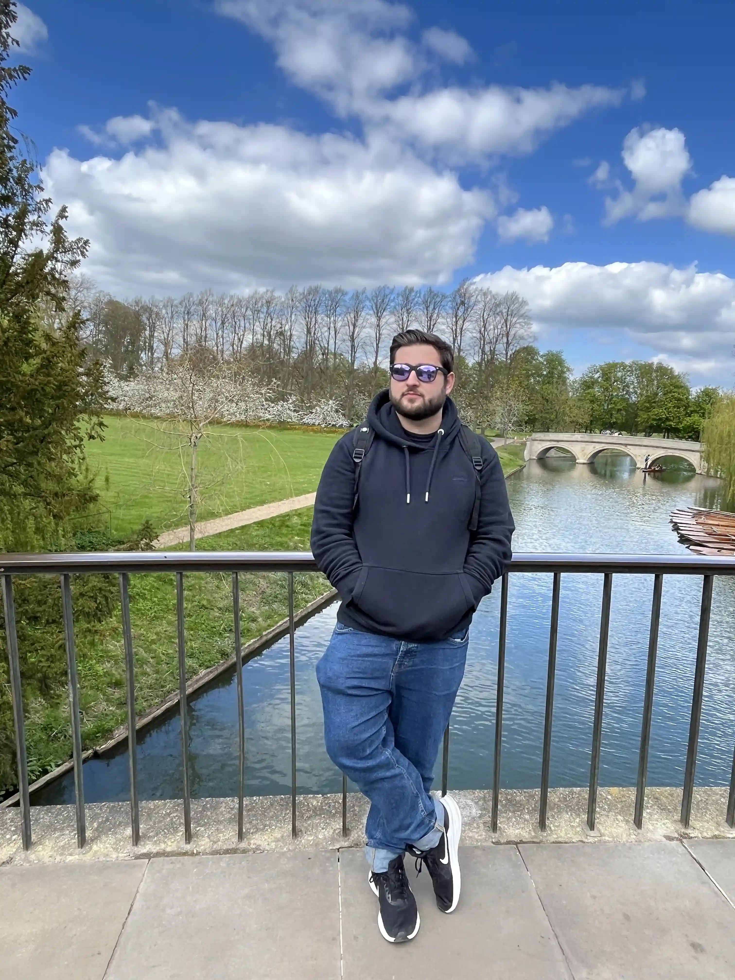 Nathan Dickson standing on a bridge in cambridge